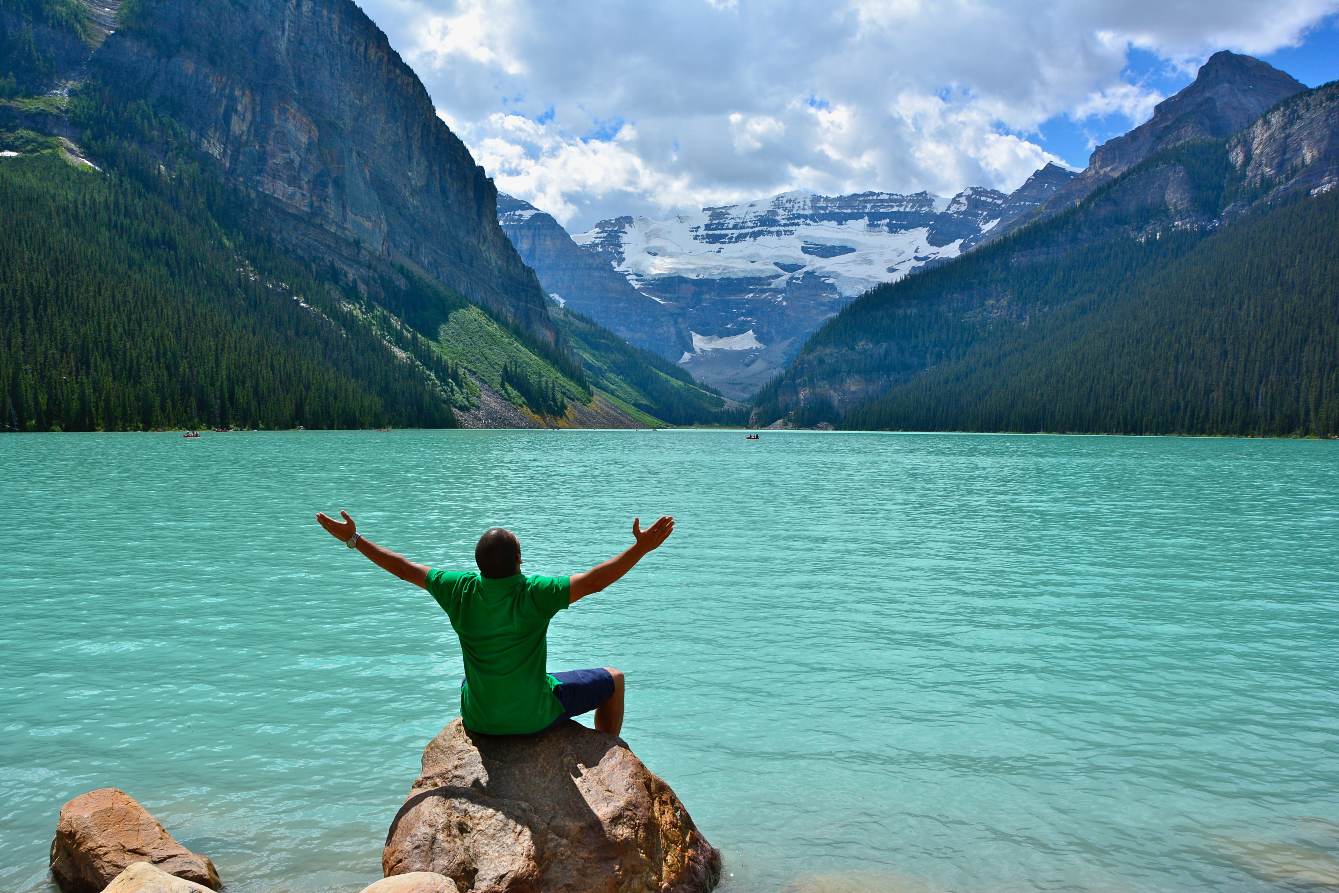 Lake Louise is a place of spiritual beauty. I just happened to take this photo of an unknown person exalting along the shoreline. 