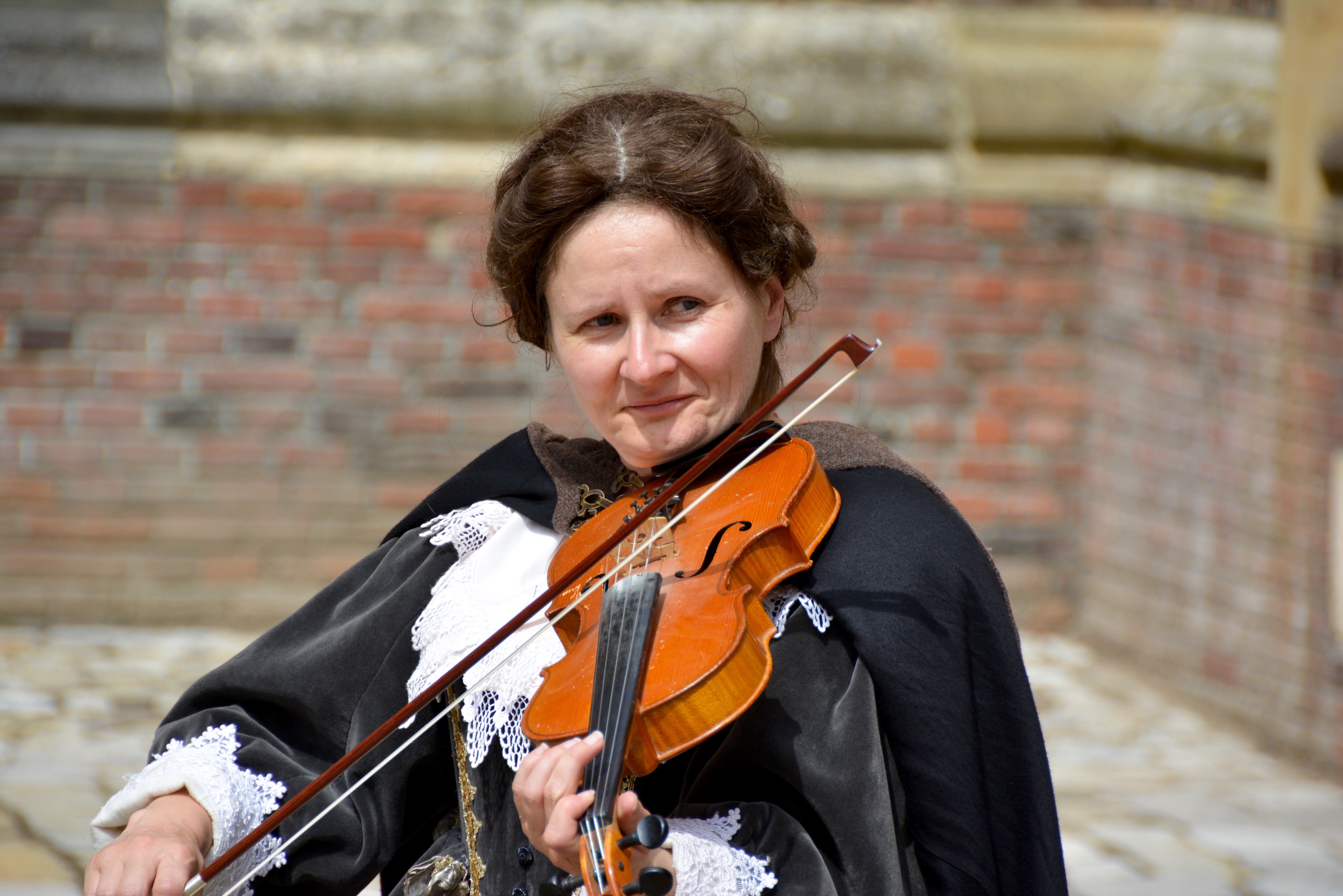 This strolling musician was photographed at Hampton Court Palace 